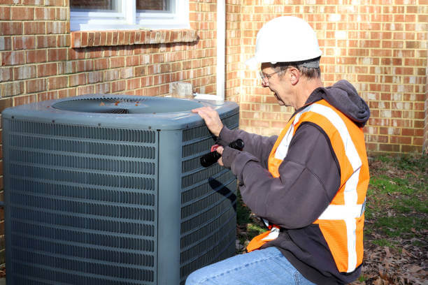 Technician working on ac duct